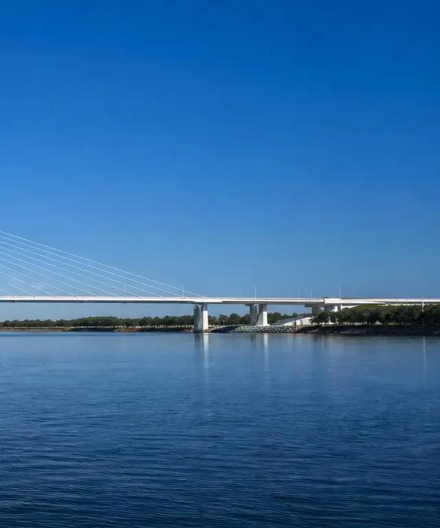 Right third of the same bridge reaching the far shore, symbolising mission
